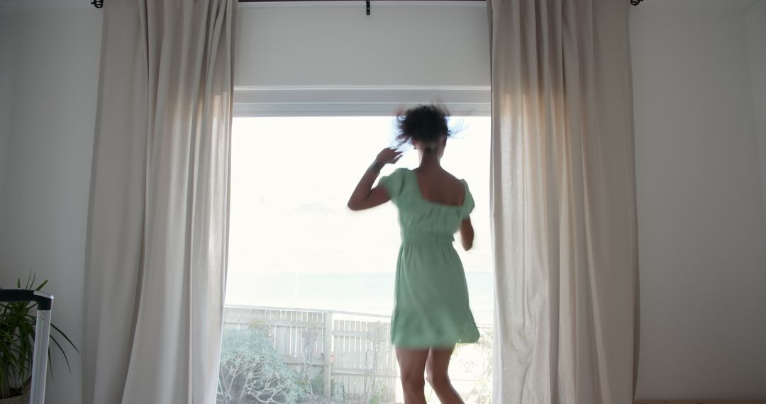 Woman Enjoying View from Coastal Home