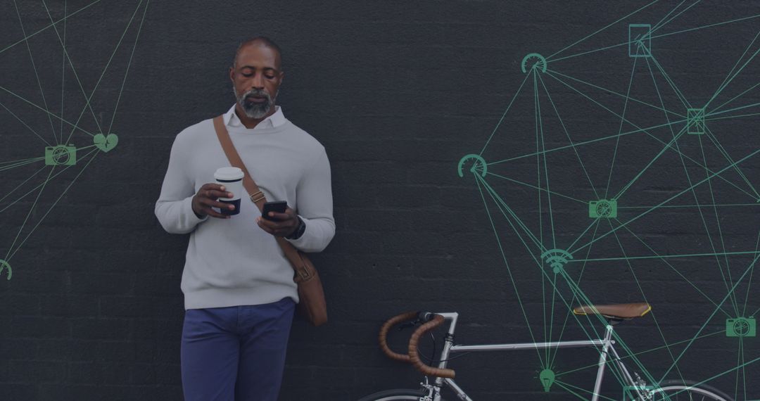 African American Man Using Smartphone Overlaid with Digital Network Icons