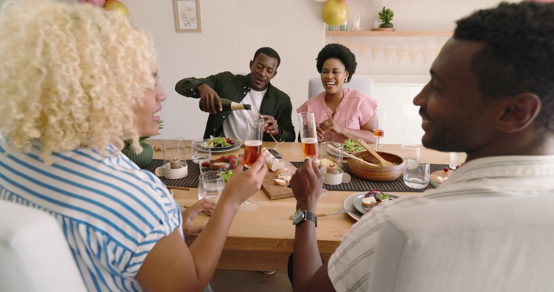 Joyful Gathering Having Wine and Salad at Home Celebration