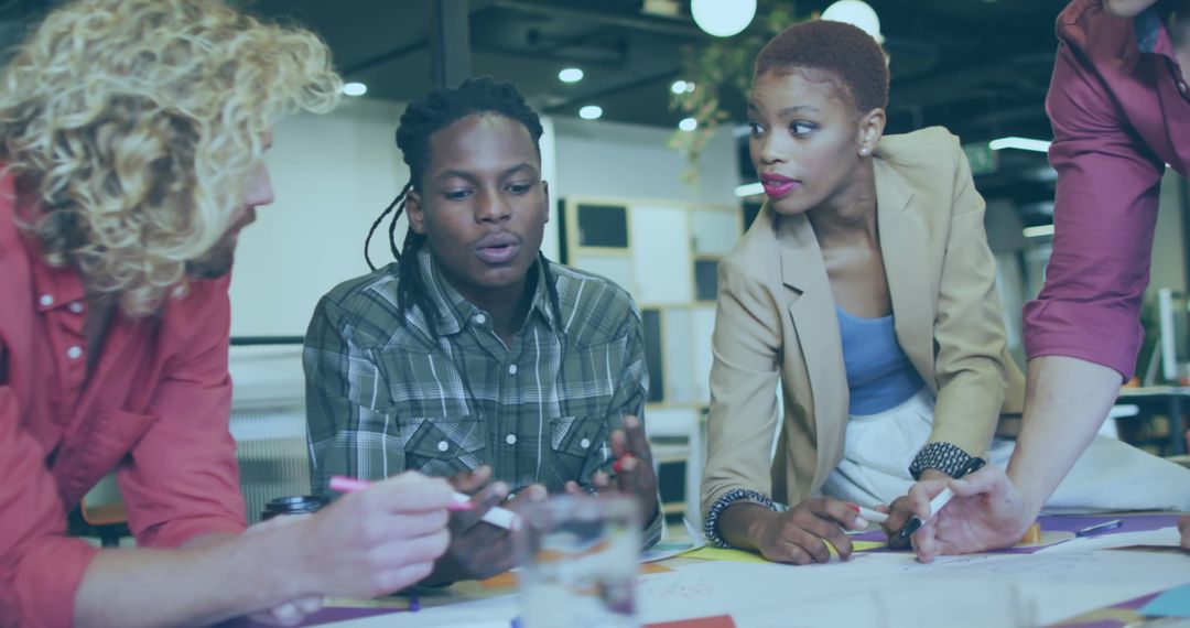 Diverse Team Collaborating on Financial Strategy in Modern Office