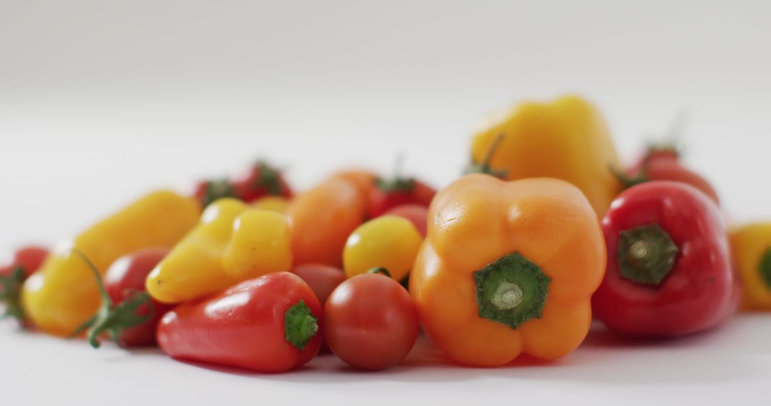 Fresh Peppers and Tomatoes on White Background