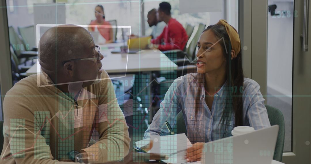 Financial Analysis Discussion in Modern Office Setting with Digital Interface