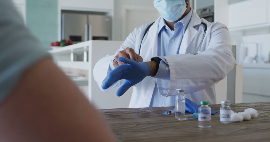 Doctor Preparing for Medical Procedure with Protective Gloves - Free Images, Stock Photos and Pictures on Pikwizard.com