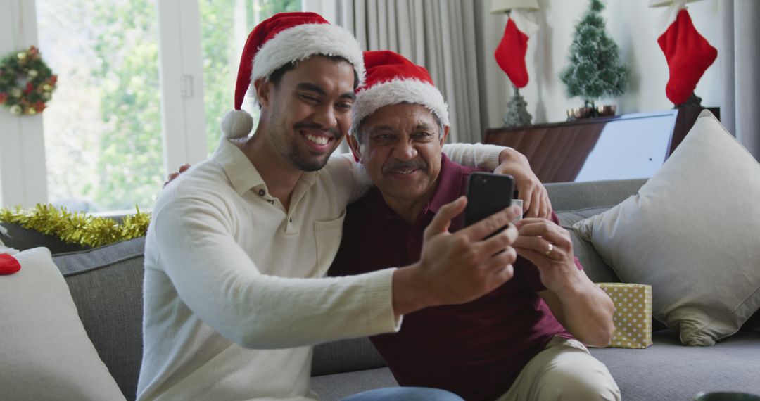 Father and Son Taking Selfie during Christmas at Home - Free Images, Stock Photos and Pictures on Pikwizard.com