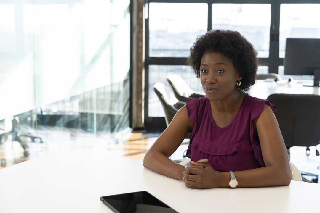 Professional Woman in Office Collaborating During Meeting