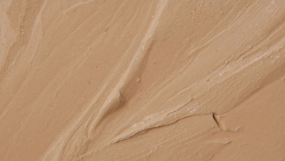 Spreading Beige Cream with Spatula Strokes, Glossy Viscous Cosmetic Texture