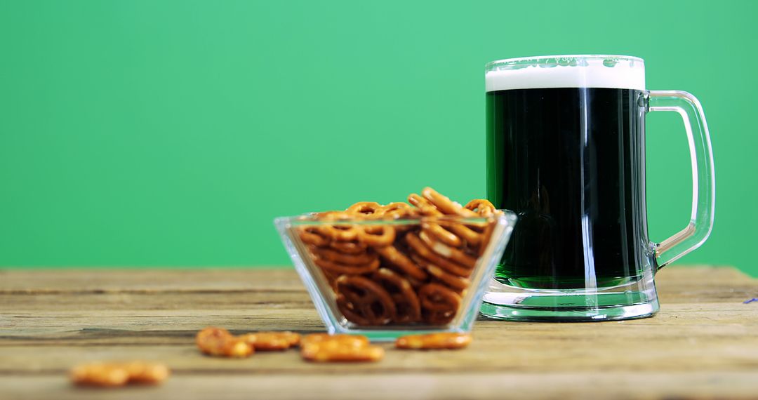 Refreshing Dark Beer in Mug with Crispy Pretzels on Wooden Table - Free Images, Stock Photos and Pictures on Pikwizard.com