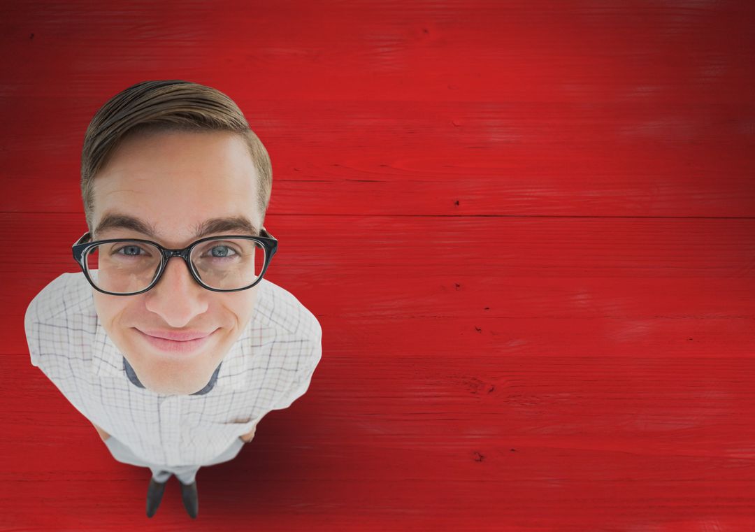 Quirky Man with Glasses on Vibrant Red Wooden Backdrop