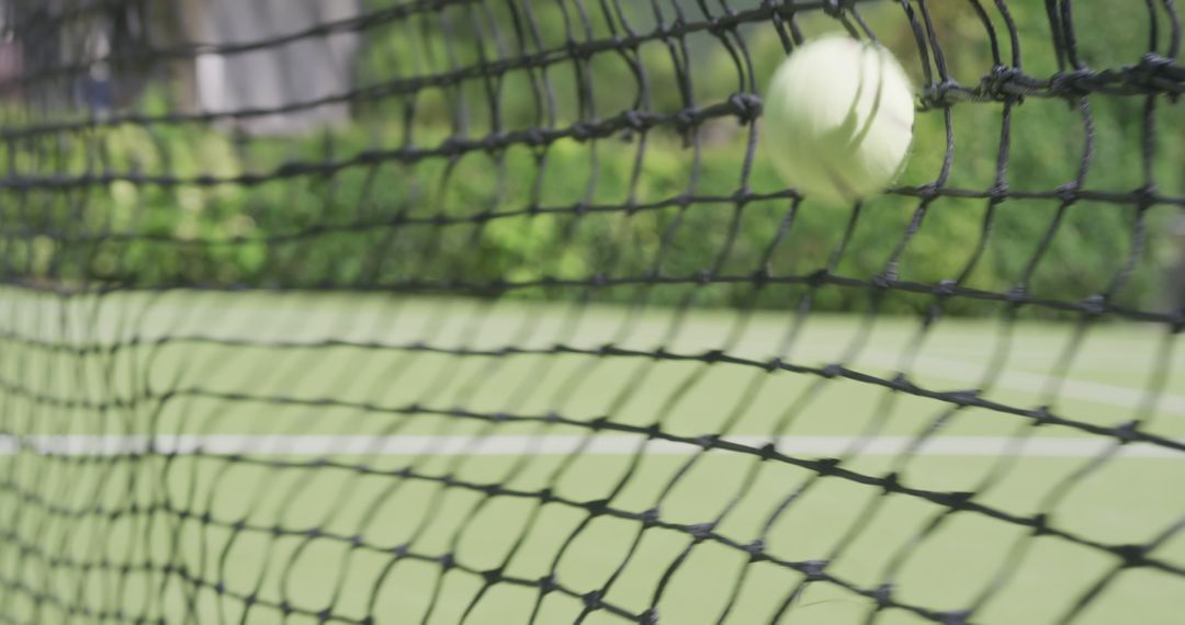 Tennis Ball Hitting Net on Outdoor Court - Free Images, Stock Photos and Pictures on Pikwizard.com