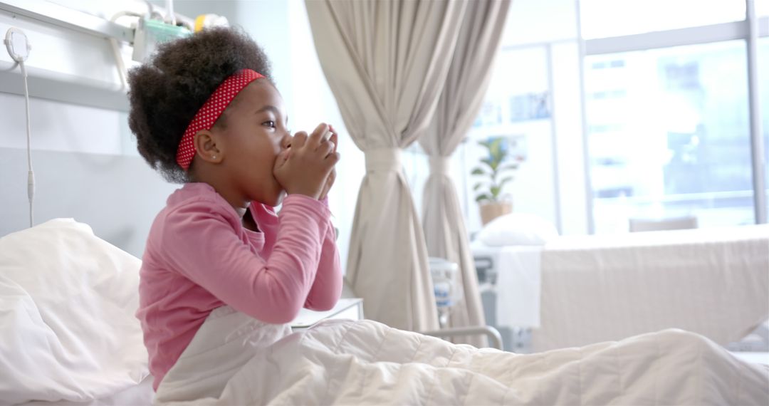 Sick African American Girl Holding Mug in Hospital Bed - Free Images, Stock Photos and Pictures on Pikwizard.com