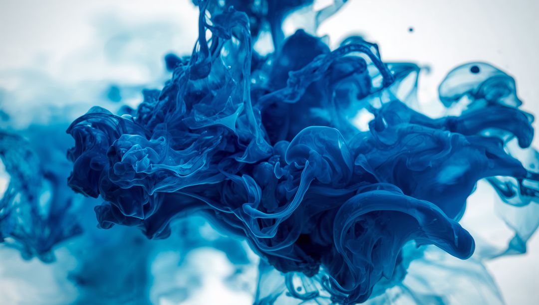 Abstract Cobalt Blue Ink Swirling in Water Creating Ethereal Fluid Shapes