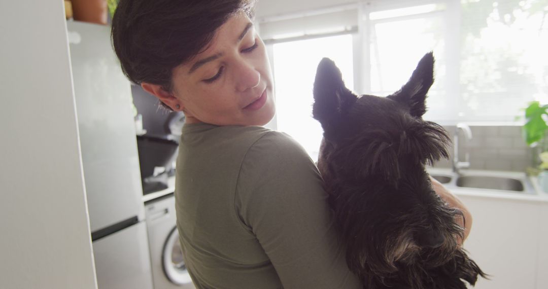 Young Woman Caring for Her Black Terrier at Home - Free Images, Stock Photos and Pictures on Pikwizard.com