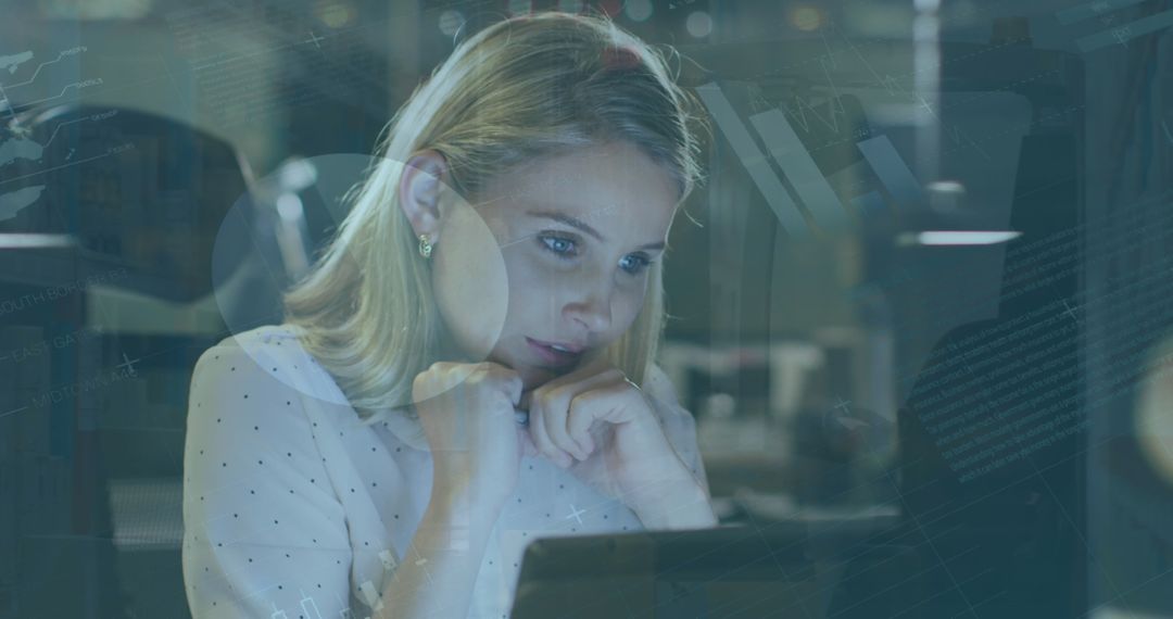 Woman Engaged in Analyzing Business Data on Computer Screen