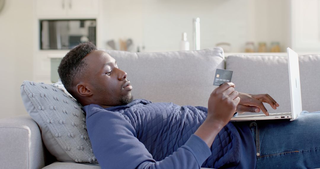 Man Relaxing on Couch with Laptop and Credit Card, Online Shopping - Free Images, Stock Photos and Pictures on Pikwizard.com