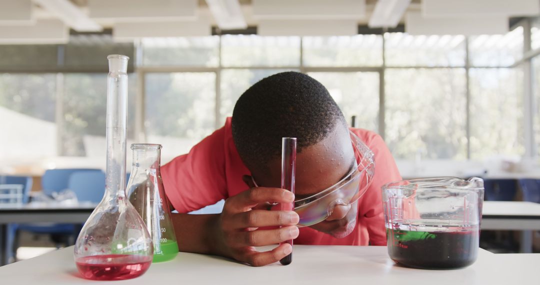 Student Analyzing Chemical Reaction in School Laboratory
