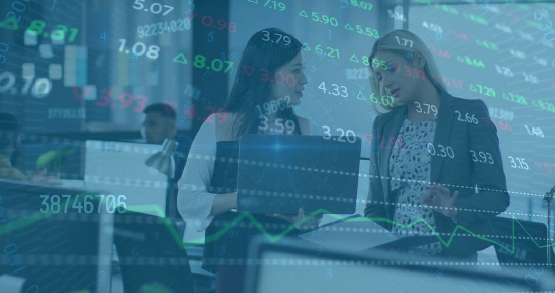 Colleagues Analyzing Financial Data in Modern Office Environment