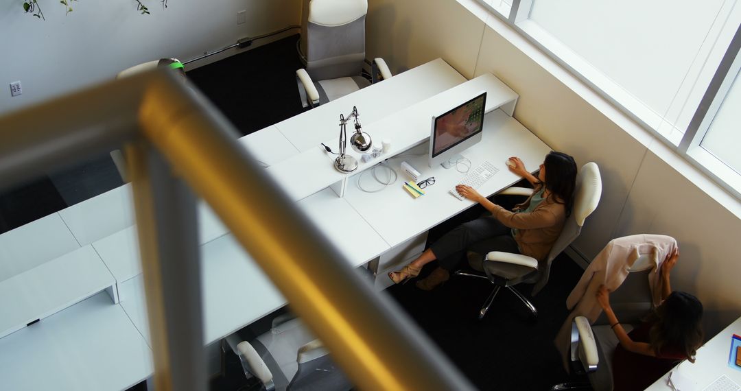 Professional Women Collaborating in Modern Office