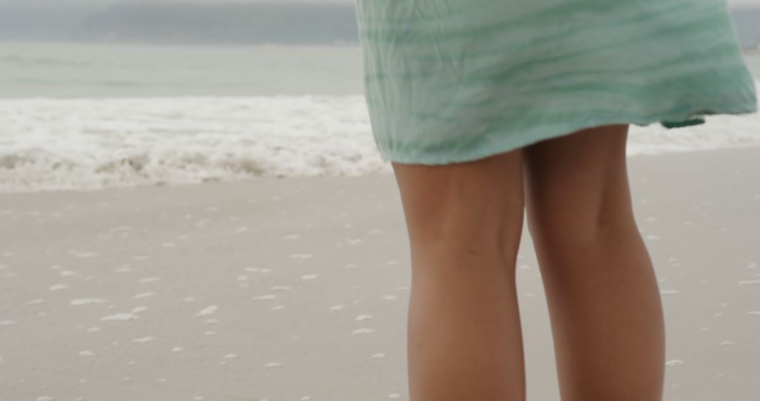 Woman in Summer Dress Stands at the Beach - Free Images, Stock Photos and Pictures on Pikwizard.com