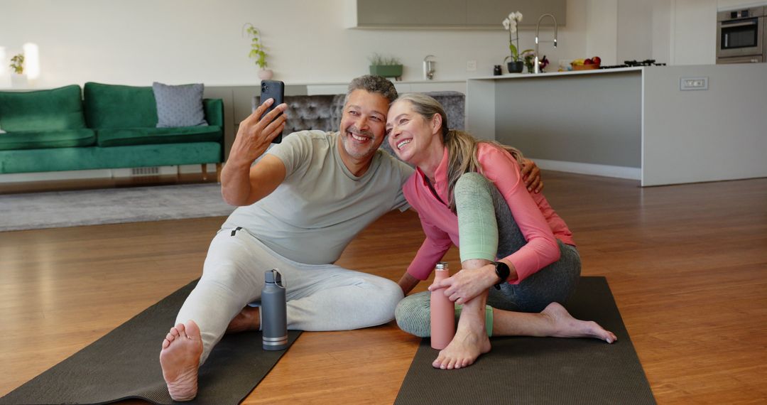 Senior Couple Enjoying Yoga and Taking Selfie in Modern Home Setting