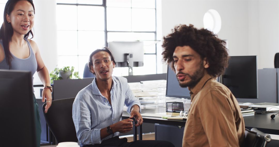 Diverse Team Having Collaborative Discussion in Modern Office