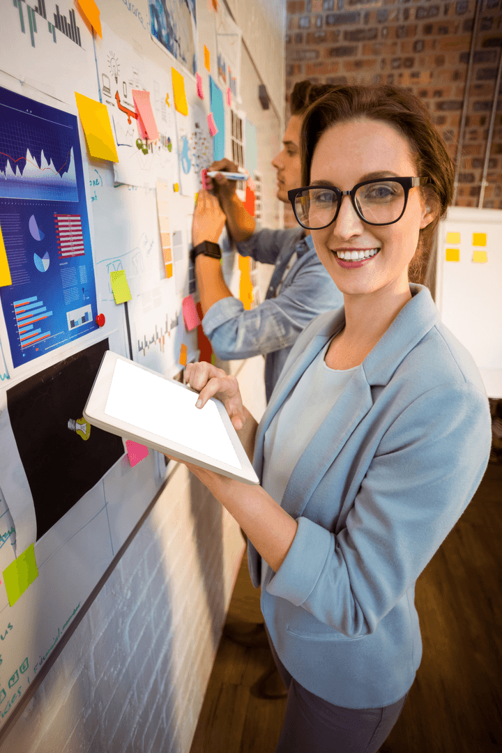 Businesswoman Holding Tablet, Collaborating in Modern Office with Transparent Insights