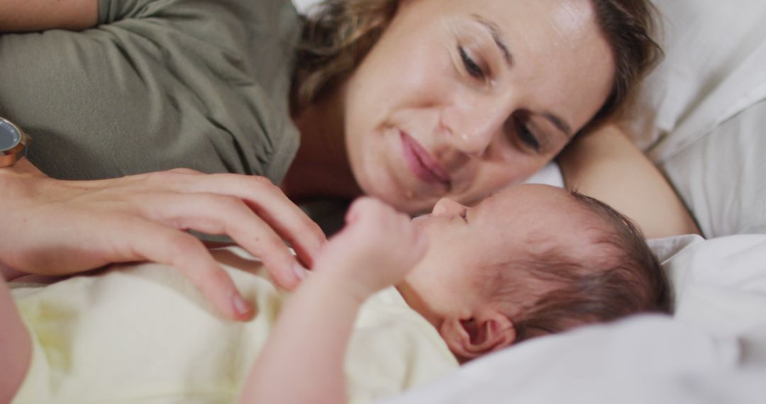 Image of happy caucasian mother kissing newborn baby - Free Images, Stock Photos and Pictures on Pikwizard.com