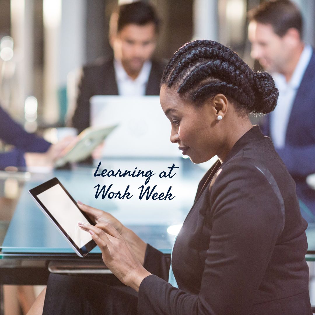 Focused Businesswoman Learning with Tablet in Modern Office