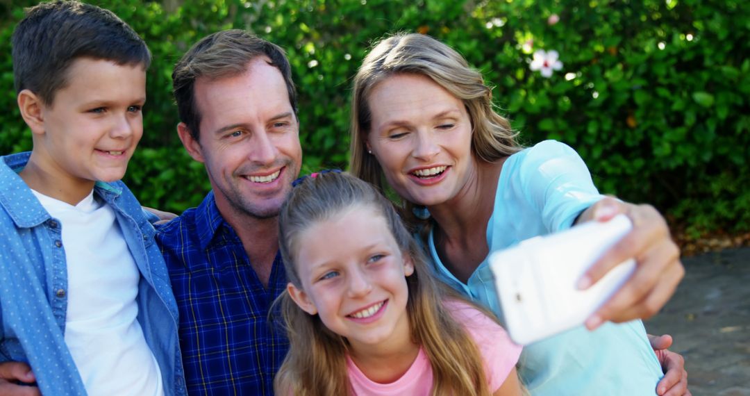 Happy family taking selfie outdoors in the park - Free Images, Stock Photos and Pictures on Pikwizard.com