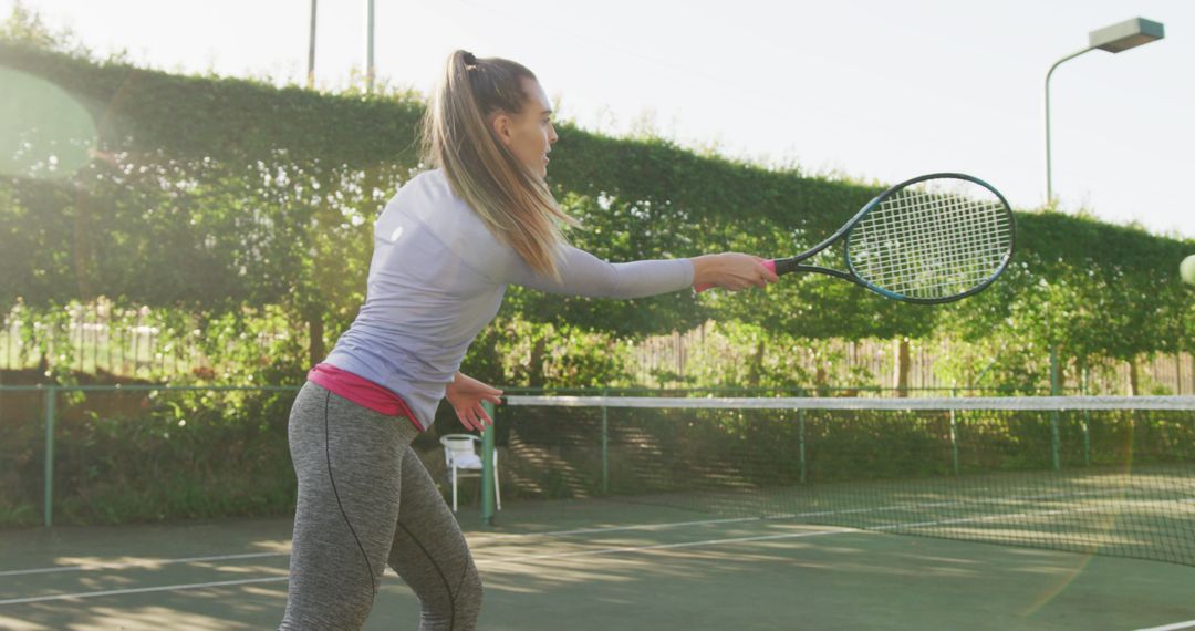 Image of happy caucasian woman playing tennis on the court - Free Images, Stock Photos and Pictures on Pikwizard.com