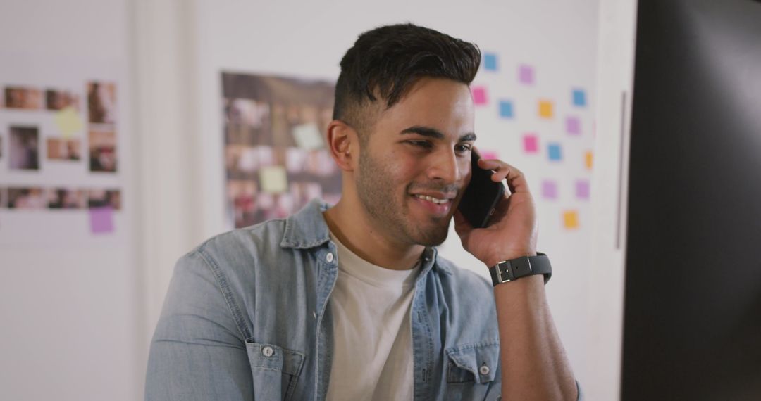 Creative Professional Engaged in Phone Call in Modern Office