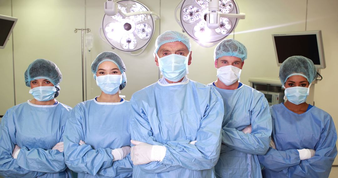 Confident Medical Team Posing in Surgical Room - Free Images, Stock Photos and Pictures on Pikwizard.com