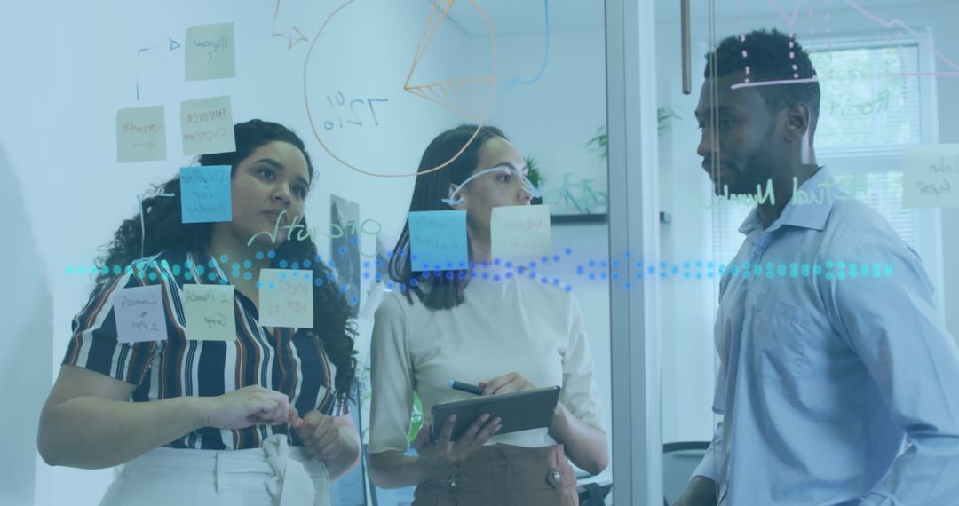 Diverse Team Analyzing Data on Transparent Board in Modern Office