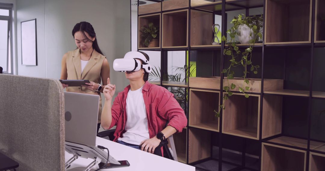 Young Professional Exploring Virtual Reality in Sleek Modern Office
