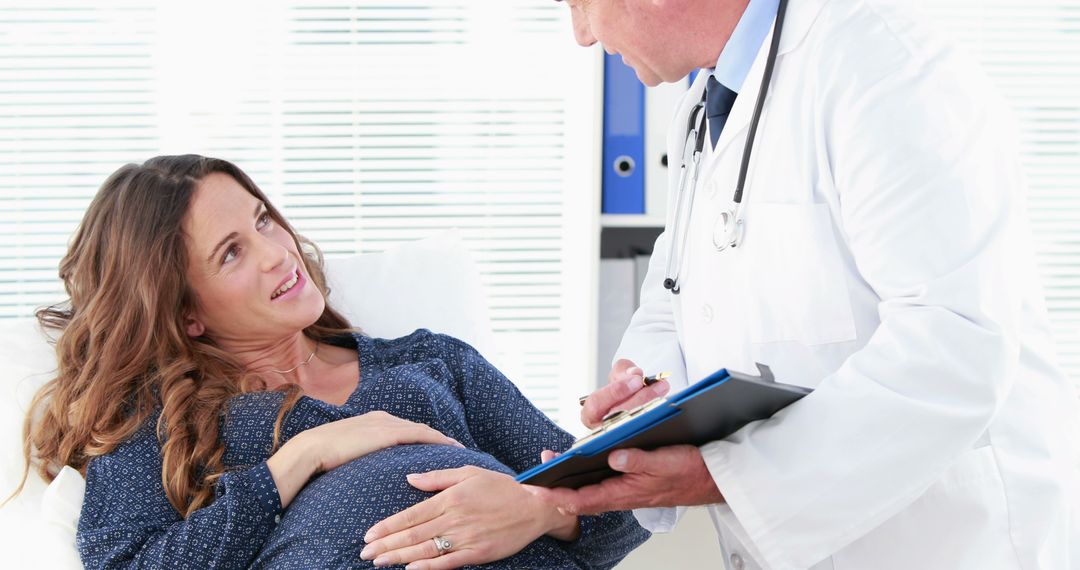 Pregnant Woman Consulting Doctor in Medical Office - Free Images, Stock Photos and Pictures on Pikwizard.com