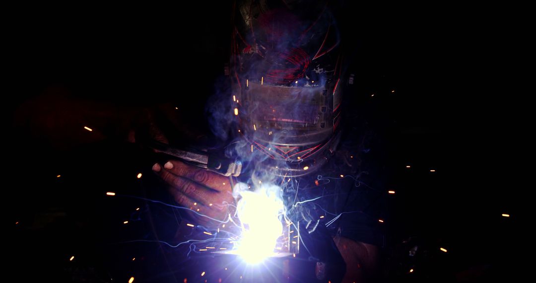 Welder in Protective Gear Using Welding Torch - Free Images, Stock Photos and Pictures on Pikwizard.com