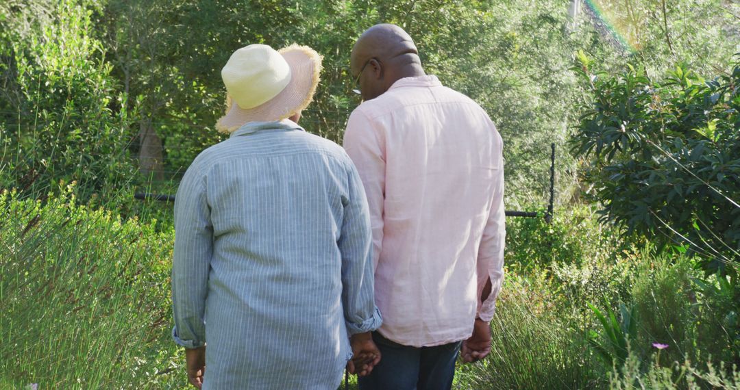 Back view of african american senior couple walking outdoors - Free Images, Stock Photos and Pictures on Pikwizard.com