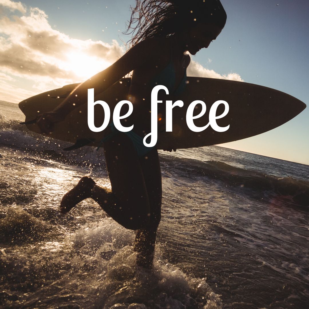 Silhouette of Surfer Running into Sea at Sunset