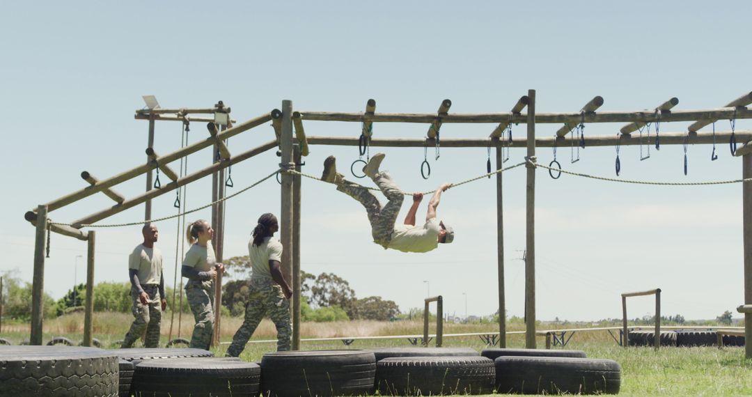 Team of Soldiers Training on Obstacle Course in Nature
