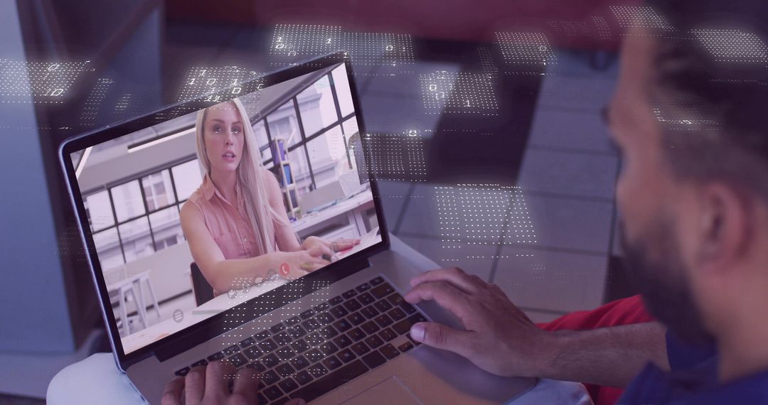 Man holding laptop while viewing remote video call woman speaking in modern workspace