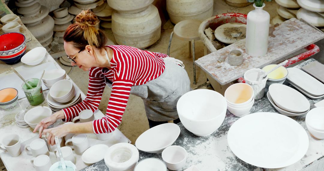 Female Artisan Creating Pottery in Studio - Free Images, Stock Photos and Pictures on Pikwizard.com