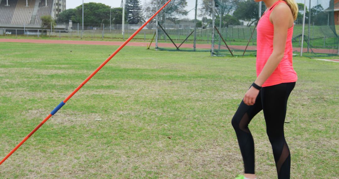 Female Athlete Practicing Javelin Throw on Sports Field - Free Images, Stock Photos and Pictures on Pikwizard.com