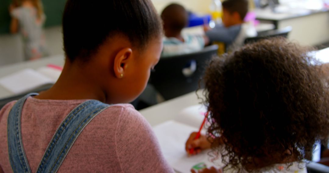 Young African American Friends Collaborating in Classroom