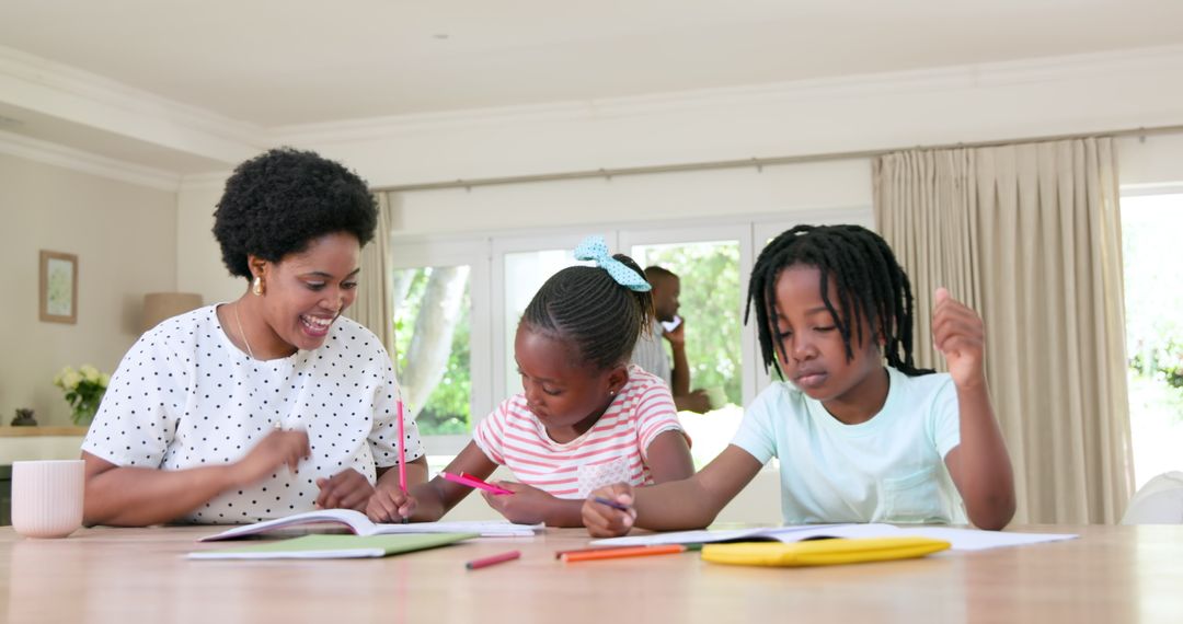 Mother Engaging with Daughters in Homework at Home