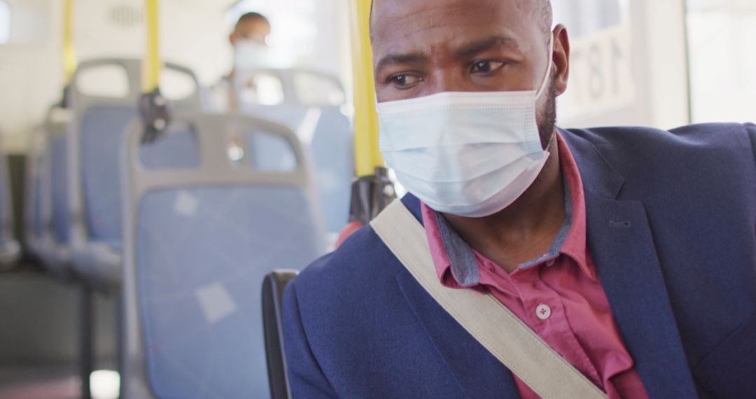 Man Wearing Face Mask Checking Smartphone on Bus During Pandemic