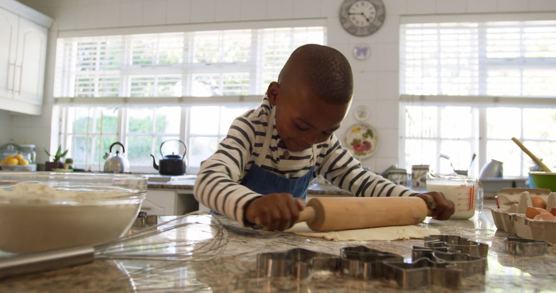 Young Boy Baking Cookies in Bright Home Kitchen - Free Images, Stock Photos and Pictures on Pikwizard.com