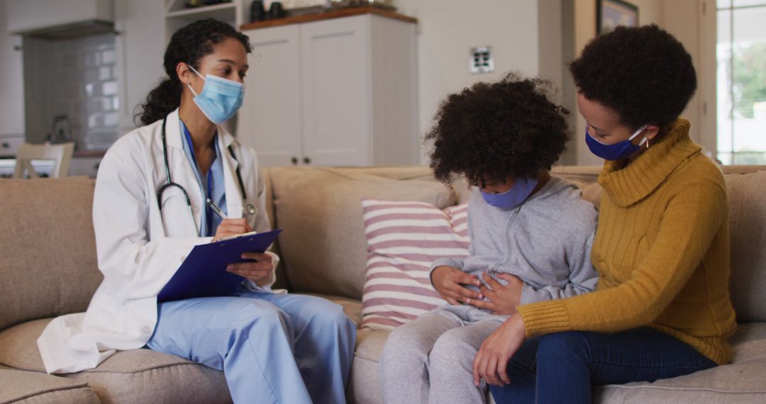 Female Doctor Examining Child with Concerned Mother in Home Visit - Free Images, Stock Photos and Pictures on Pikwizard.com