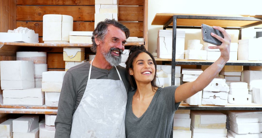 Pottery Artists Taking Selfie in Ceramic Studio - Free Images, Stock Photos and Pictures on Pikwizard.com