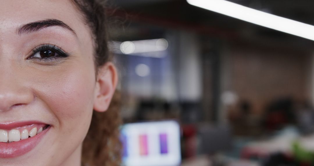 Close-Up of Young Woman Smiling with Office Background - Free Images, Stock Photos and Pictures on Pikwizard.com