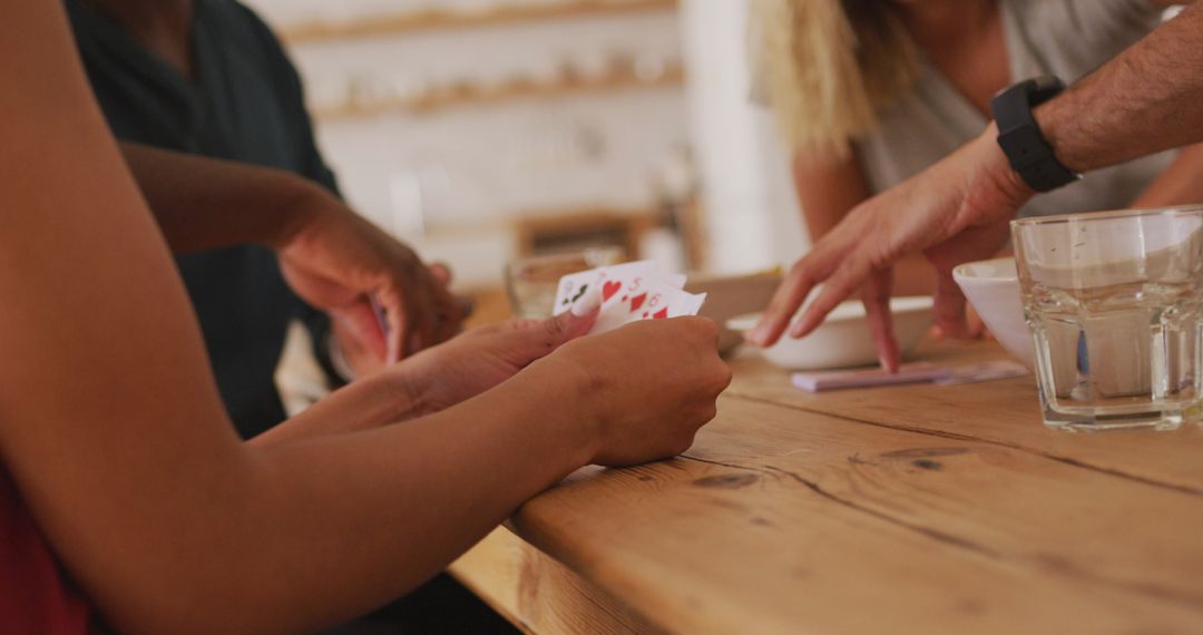 Friends Relaxing with Card Game at Home