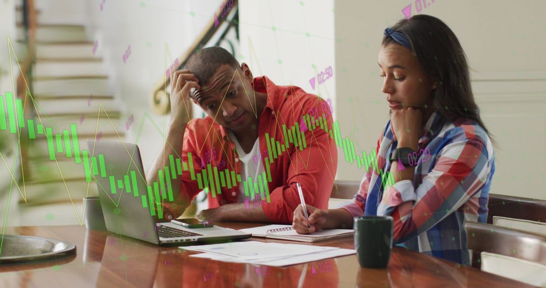 Diverse Business Team Analyzing Financial Data Charts on Laptop